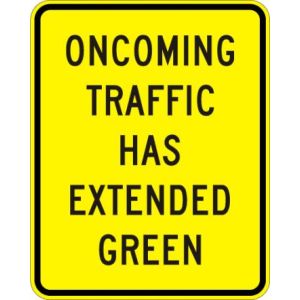 Oncoming Traffic Has Extended Green Sign - W25-1