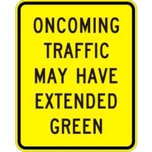 Oncoming Traffic May Have Extended Green Sign - W25-2