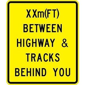 Between Highway And Tracks Sign - W10-11b