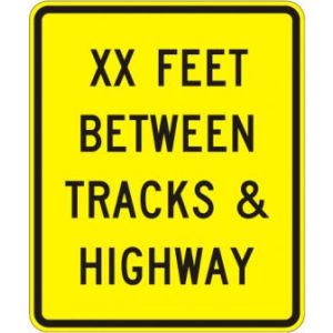 Between Highway And Tracks Sign - W10-11a